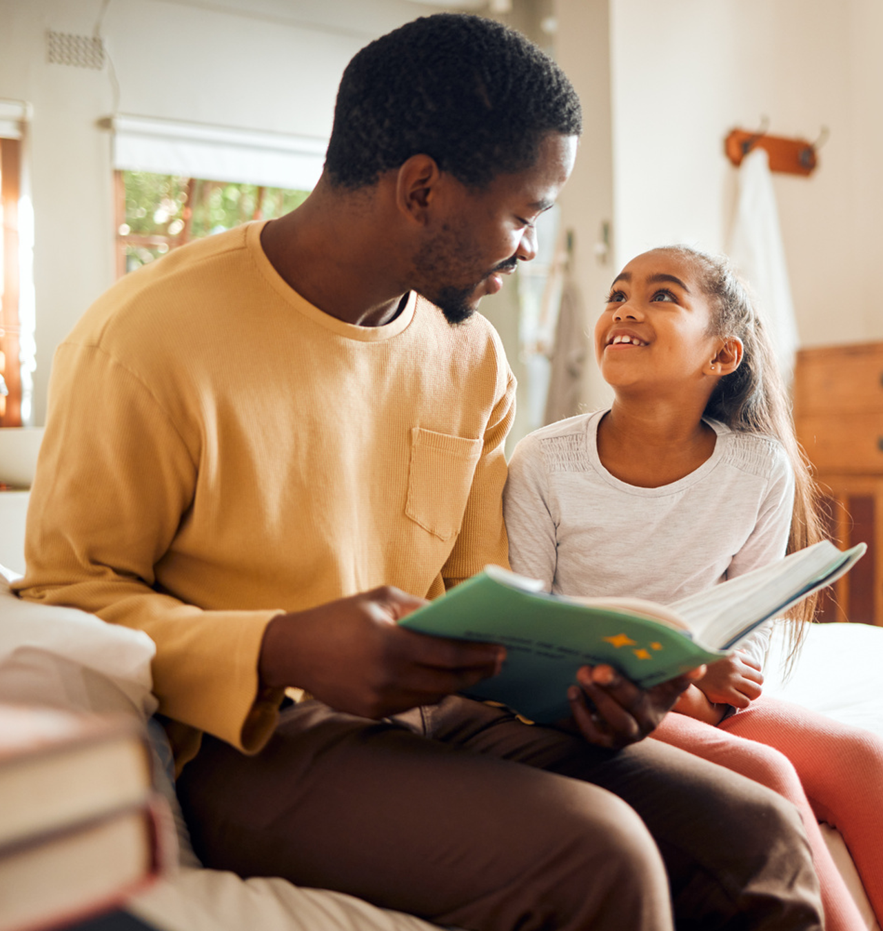 Dad reading to Daughter